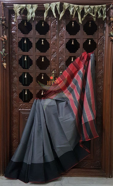 Grey cotton blended saree with contrasting black maroon border and striped pallu.