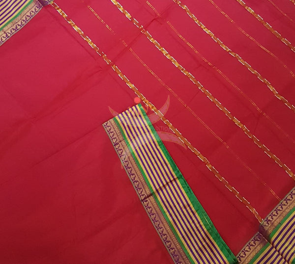 Red cotton blended saree with contrasting green border and striped pallu.