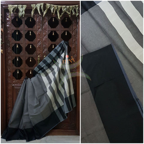 Grey cotton blended saree with contrasting black border and striped pallu.