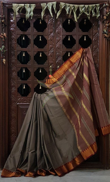 Bronze grey merserised dharwad cotton with traditional maroon red border and striped pallu.