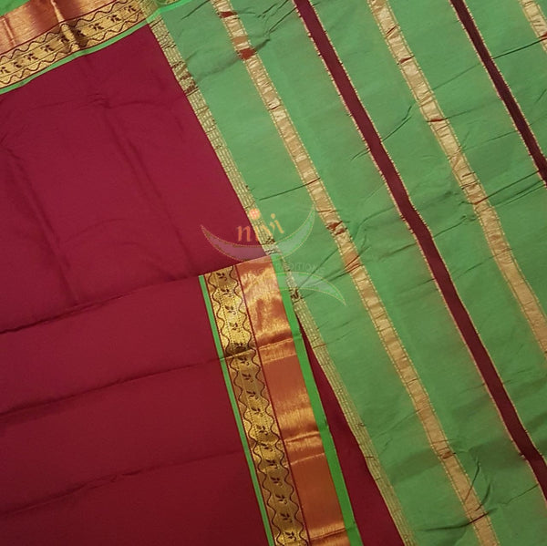 Red with green merserised dharwad cotton with traditional green border and striped pallu.