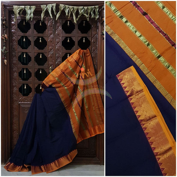 Royal blue with mustard merserised dharwad cotton with traditional mustard border and striped pallu.
