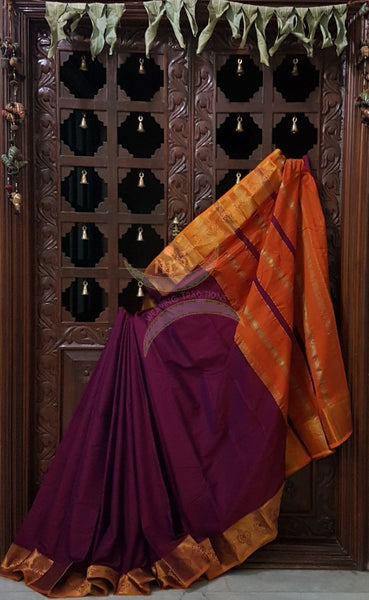 Meganta with orange merserised dharwad cotton with traditional orange border and striped pallu.