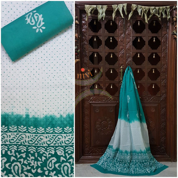 Off white with sea green batik three piece pure merserised cotton suit with self woven floral pattern all over.