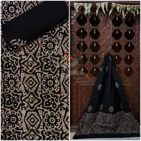 Black Batik printed three piece pure merserised cotton suit.dress material is printed with abstract floral motif.