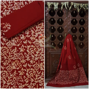 Red Batik printed three piece pure merserised cotton suit. Dress material is printed with abstract floral motif.