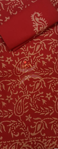 Red Batik printed three piece pure merserised cotton suit.dress material is printed with abstract floral motif.
