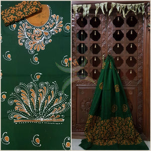 Bottle green with mustard Batik printed three piece pure merserised cotton suit.dress material is printed with abstract floral motif.