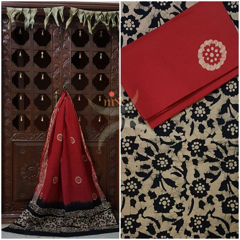 Black with Maroon Batik printed three piece pure merserised cotton suit. Dress material is printed with abstract floral motif.