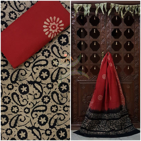 Black with Maroon Batik printed three piece pure merserised cotton suit. Dress material is printed with abstract paisley and floral motif.