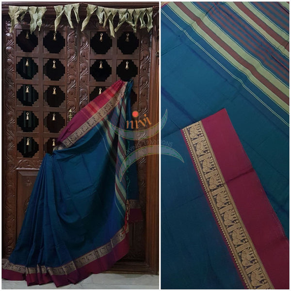 Teal with magenta  Eco friendly natural dyed soft organic cotton with mercerised finish. The saree has thread woven traditional border and  striped pallu.