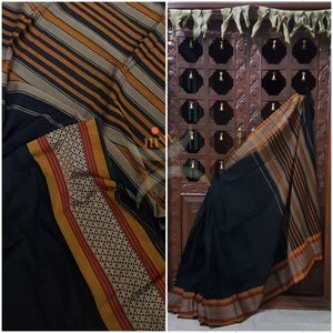 Black with mustard  Eco friendly natural dyed soft organic cotton with mercerised finish. The saree has thread woven traditional border and  striped pallu.
