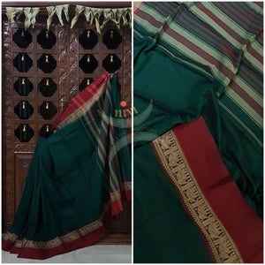 Bottle green with Maroon Eco friendly natural dyed soft organic cotton with mercerised finish. The saree has thread woven traditional border and  striped pallu.