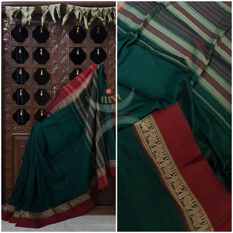 Bottle green with Maroon Eco friendly natural dyed soft organic cotton with mercerised finish. The saree has thread woven traditional border and  striped pallu.