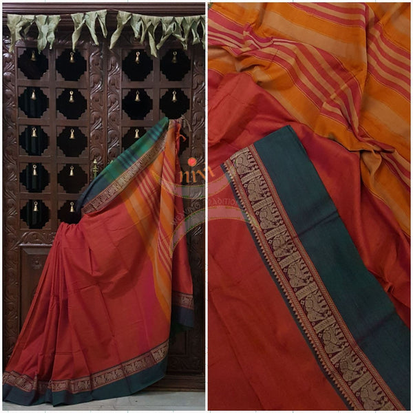Peachish pink with teal Eco friendly natural dyed soft organic cotton with mercerised finish. The saree has thread woven traditional border and  striped pallu.
