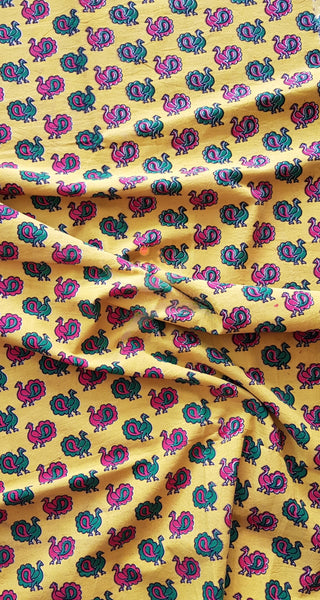 Yellow handloom cotton kalamkari with traditional peacock motifs. Width of the fabric is up to 43 inches