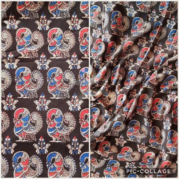 Black handloom cotton kalamkari with traditional peacock motifs. Width of the fabric is up to 43 inches.