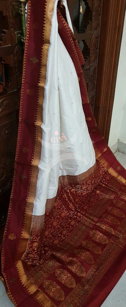 White with Maroon Handloom soft kanjivaram silk with Traditionally woven pallu and border.