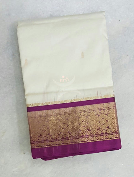 White with purple Handloom kanjivaram silk with Traditionally woven pallu and border.