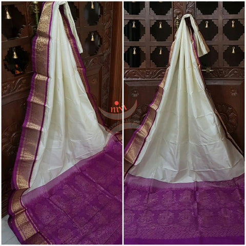 White with purple Handloom kanjivaram silk with Traditionally woven pallu and border.