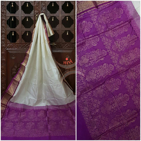 White with purple Handloom kanjivaram silk with Traditionally woven pallu and border.