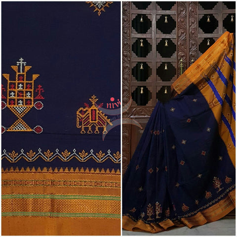 Royal blue with mustard silk cotton kasuti embroidered Ilkal with Anne ambari motif and traditional tope teni pallu . 
