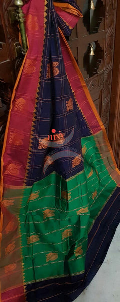 Royal blue with maroon and green sico traditional South saree with peacock motif allover the saree, border and pallu.