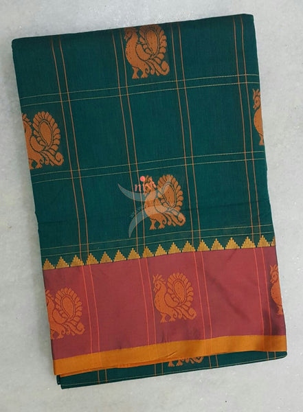 Green with maroon sico traditional South saree with peacock motif allover the saree, border and pallu.
