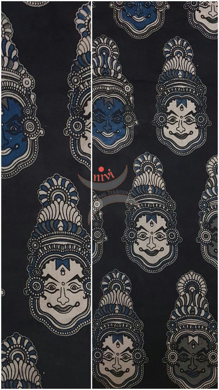 Black handwoven cotton kalamkari material with kathakali face motifs.