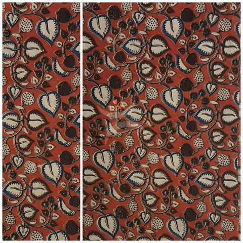 Red handwoven cotton kalamkari material with floral motifs.