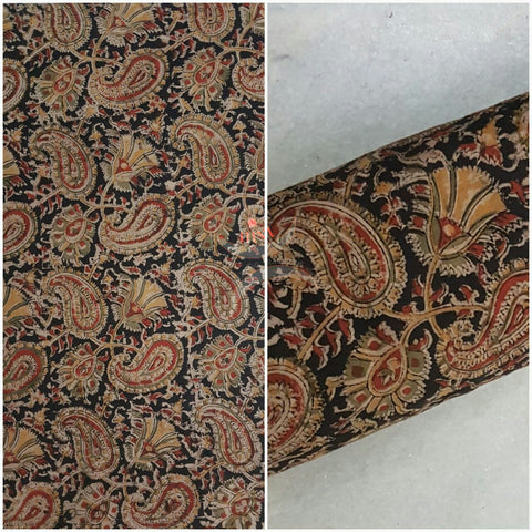 Black handwoven cotton kalamkari material with Paisley motifs.