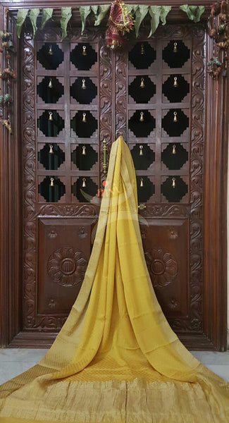 Yellow 70 gram pure crepe silk with zari border and pallu