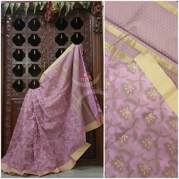 Pink sico Benaras with allover woven floral motif and suble zari pallu.