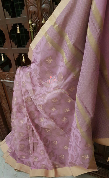 Pink sico Benaras with allover woven floral motif and suble zari pallu.