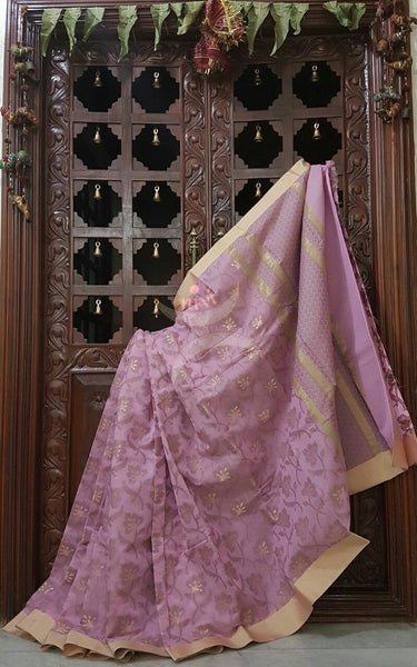 Pink sico Benaras with allover woven floral motif and suble zari pallu.