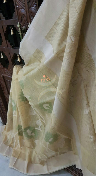 Cream silk cotton woven saree with allover floral motif