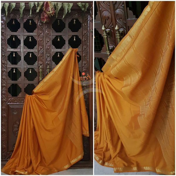 Art silk crepe with woven zari border and pallu.