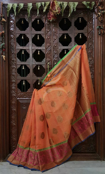 Orange Linen Cotton Benaras Brocade saree with antique zari weaving all over the saree.
