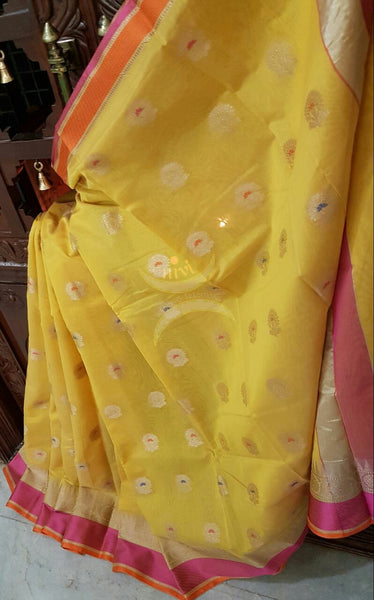 Yellow silk cotton benaras brocade saree with satin finish contrasting pallu and border and antique gold zari woven on border