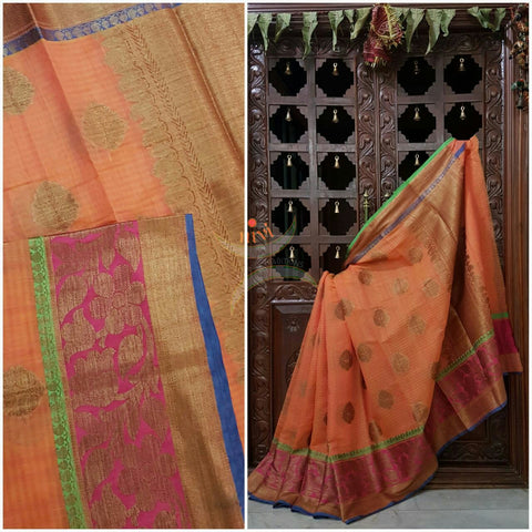 Orange Linen Cotton Benaras Brocade saree with antique zari weaving all over the saree.
