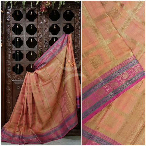 Peach Linen Cotton Benaras Brocade saree with antique zari weaving all over the saree.