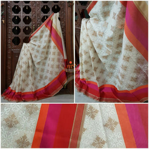 White pure cotton mercerised saree with satin finish contrasting pallu and border and embroidery all over the saree.
