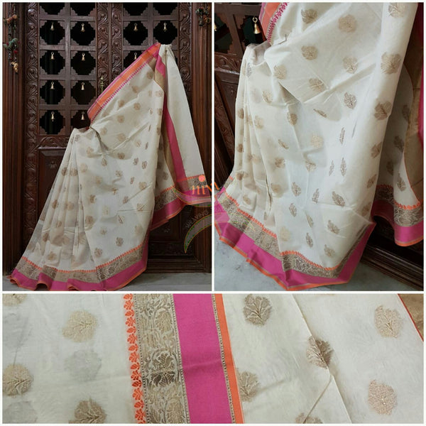 White silk cotton benaras brocade saree with satin finish contrasting pallu and border and antique gold zari woven on border and booties all over