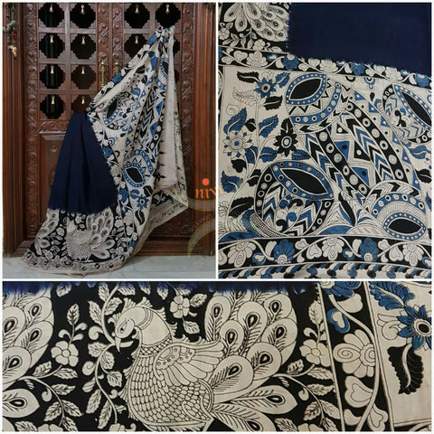 Navy blue Chennur silk kalamkari with intricate peacock motif, musical instruments and floral motif on pallu and on border.