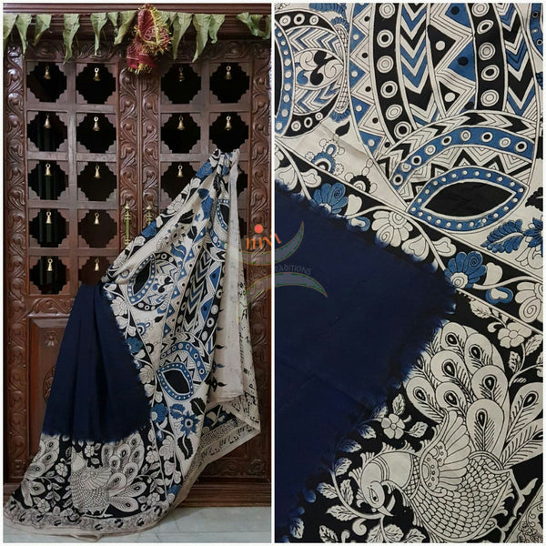 Navy blue Chennur silk kalamkari with intricate peacock motif, musical instruments and floral motif on pallu and on border.