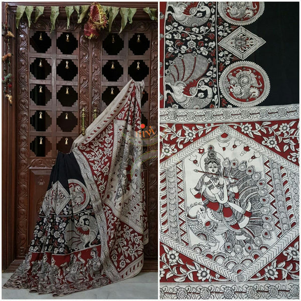 Black chennur silk kalamkari with intricate peacock motif and dancing figuremotif on pallu and on border.
