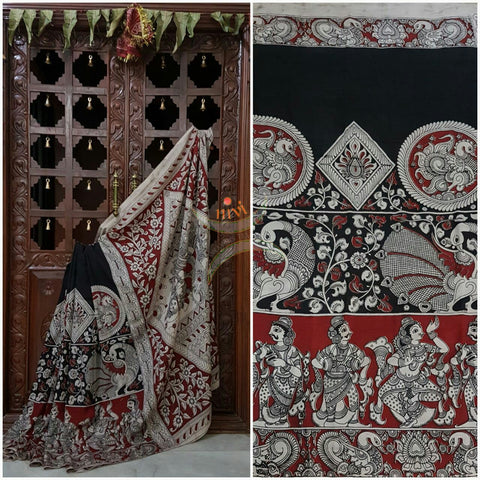 Black chennur silk kalamkari with intricate peacock motif and dancing figuremotif on pallu and on border.