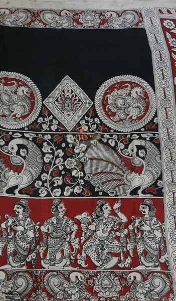 Black chennur silk kalamkari with intricate peacock motif and dancing figuremotif on pallu and on border.