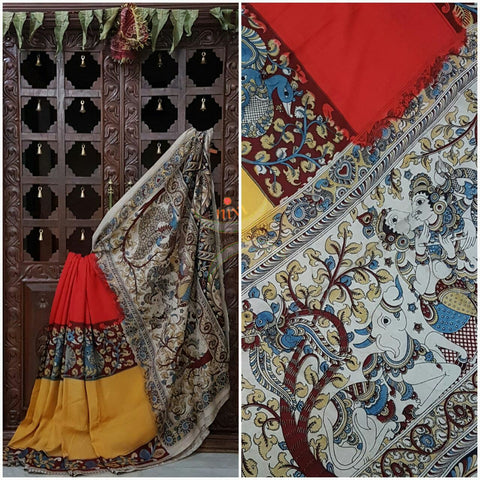 Red yellow chennur silk kalamkari with intricate peacock motif and Radha Krishna motif on pallu and on border.