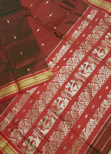 Brown silk Paithani with traditional peocock motif comes with contrasting red border and pallu.